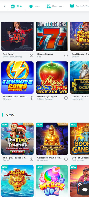 Spinoli Casino mobile slots lobby screenshot showing game categories (Slots, New, Featured, Book Of Slots) with titles including Red Baron, Coyote Sevens, Thunder Coins Hold and Win, More Magic Apple, and dedicated "New" section featuring The Tipsy Tourist Christmas Edition, Colossus Fortune Hold and Win, Book of Ganesh, Dragon Awaken, and Merge Up 2 - tested